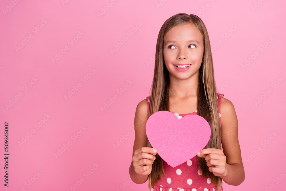 Photo of lovely cute person hands hold heart symbol card look empty space isolated on pink color background Photo of lovely cute person hands hold heart symbol card look empty space isolated on pink color background