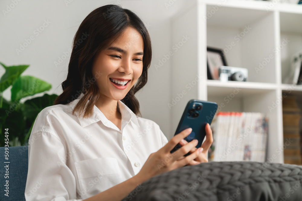 Woman holding a smartphone and using online social on lifestyle. Technology for communication concept. Woman holding a smartphone and using online social on lifestyle. Technology for communication concept.
