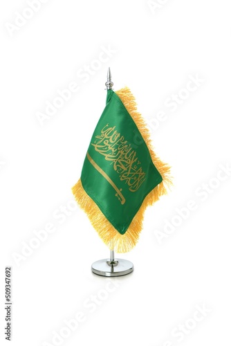 Saudi Arabian flag hanging on the metallic pole.