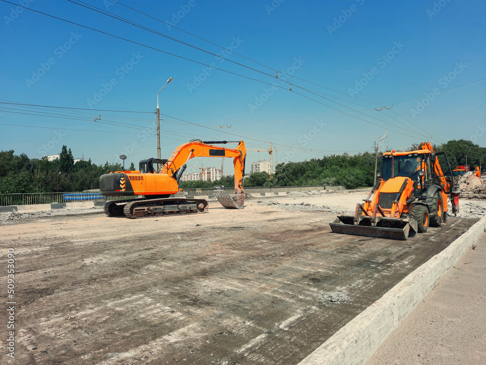 Excavator repairs the road, road works Excavator repairs the road, road works