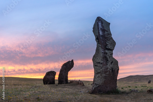 stone idols in the steppe on the background of sunset. place of power ancient tombstones of Tagar culture in khakassia russia photo