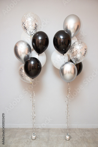 arrangement of black and silver balloons for birthday