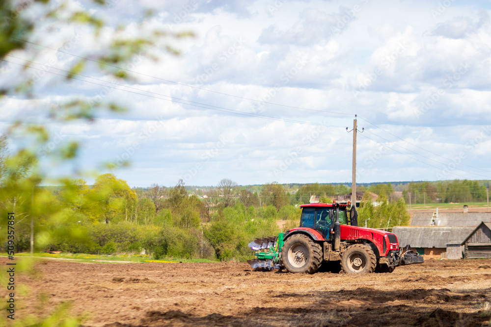 Tractor plowing fields -preparing land for sowing Tractor plowing fields -preparing land for sowing