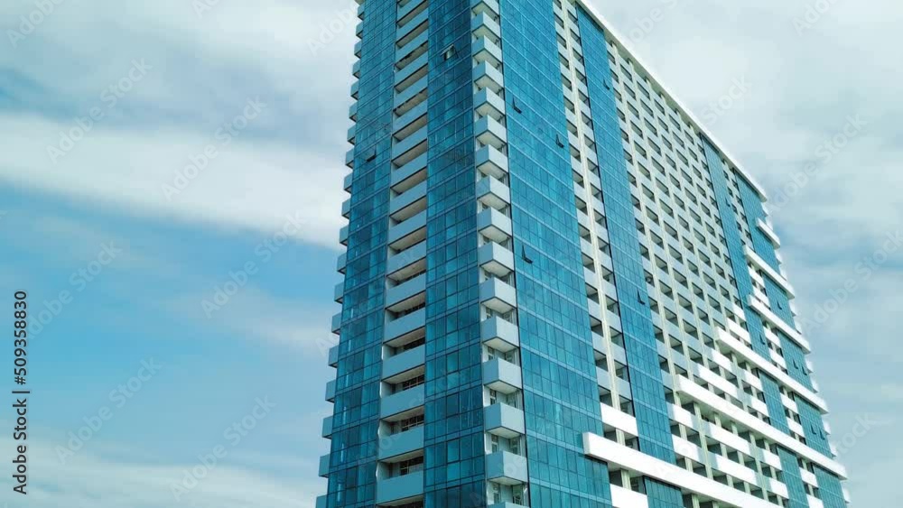 Newly built building. Part of modern residential apartment with exterior of flat building. Detail of New elite house and home complex. Fragment of urban real estate and condominium architecture. Newly built building. Part of modern residential apartment with exterior of flat building. Detail of New elite house and home complex. Fragment of urban real estate and condominium architecture.
