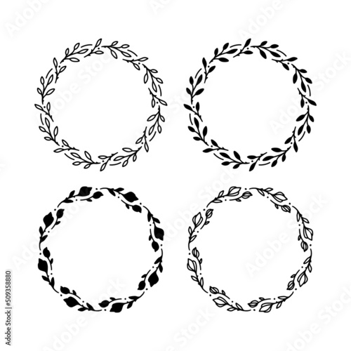 Set of 4 hand drawn spring wreaths isolated on white background, vector. Outline and silhouette frames with leaves. Doodle style.Collection of floral monogram frames.