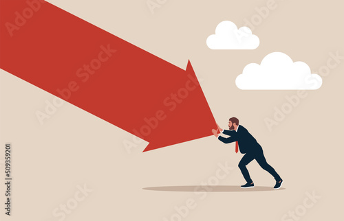 Man pushing falling down arrow with full effort. Survive investment crash, crisis or recession, pushing back or effort to win business challenge, economic recession.