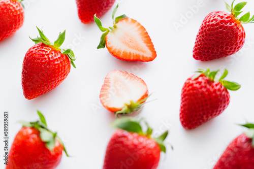 Close up view of fresh strawberries on white background.