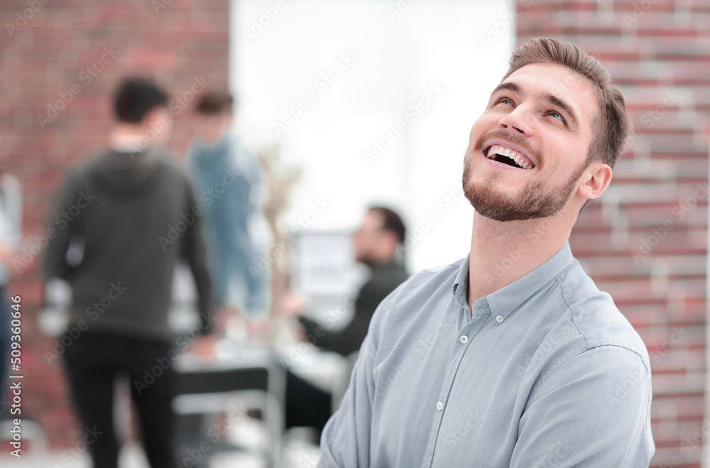 Cheerful man smiling in office. Cheerful man smiling in office.