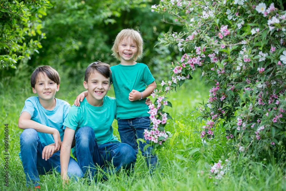 Grandmother and grandchildren, playing together in the park, spring Grandmother and grandchildren, playing together in the park, spring