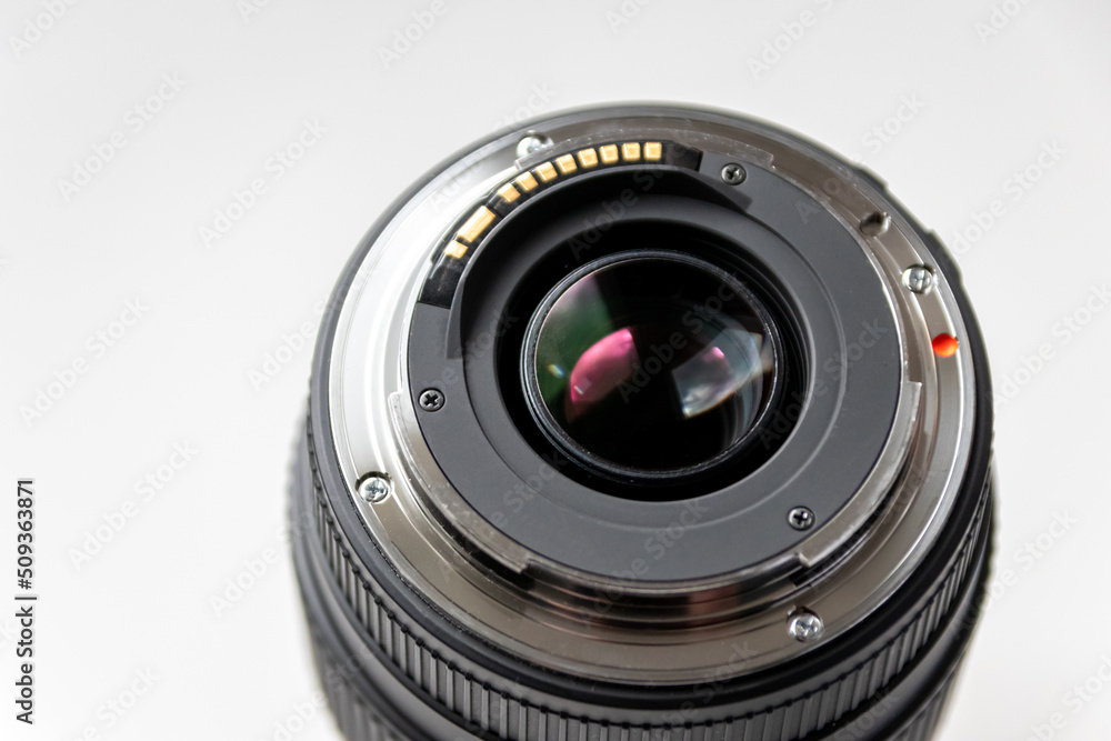 Back side of a dslr camera lens objective for professional photography with camera mount details in macro view with beautiful lens details for optical precision in portrait photography