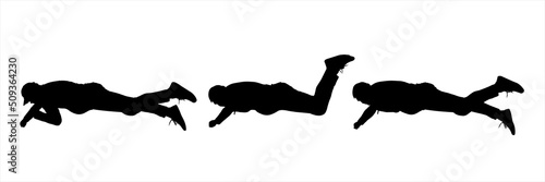 The rescuer tries to get something from below, stretches out his hand, and diligently rests his feet. A guy in a tracksuit and sneakers lies on his stomach. Three black silhouettes isolated on white