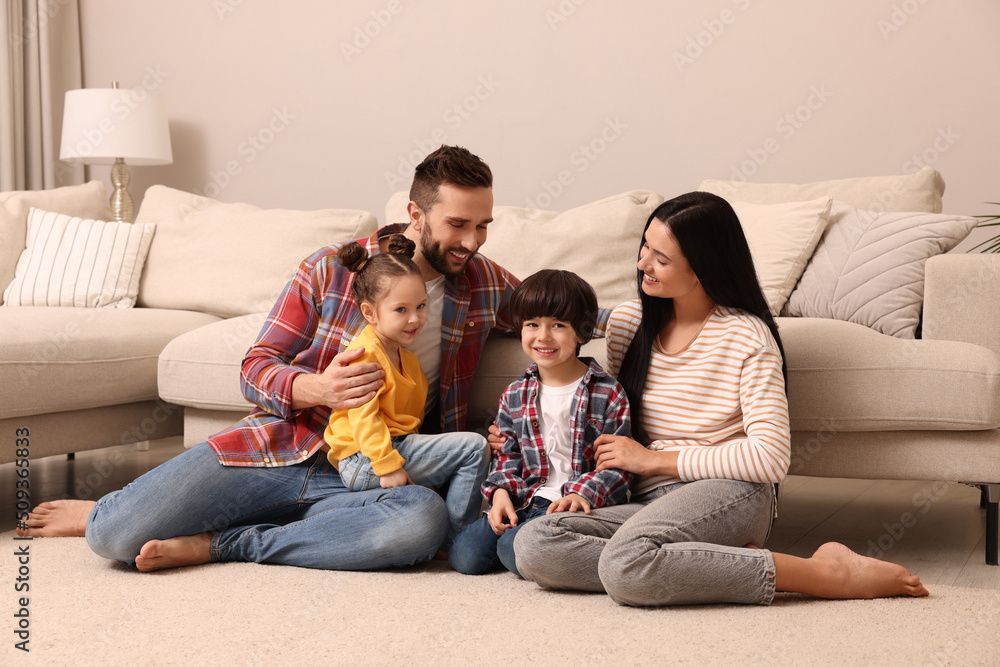 Happy family spending time together in living room Happy family spending time together in living room