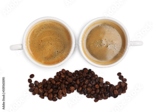 Face made with cups of coffee as eyes and beans as mustache on white background, top view
