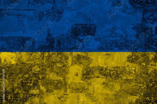 Flag of Ukraine on old grunge wall in background