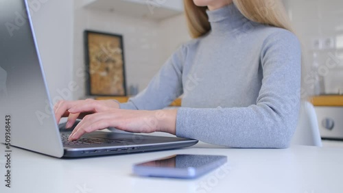 Wallpaper Mural Woman working on laptop. Female person typing text on a computer at home Torontodigital.ca