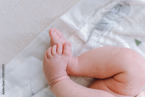 Newborn feet, innocence, maternity and babyhood concept