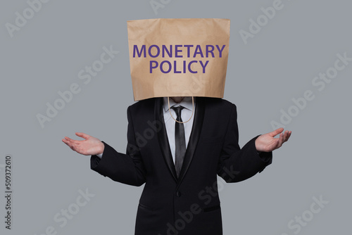Monetary policy concept. Businessman think about monetary policy