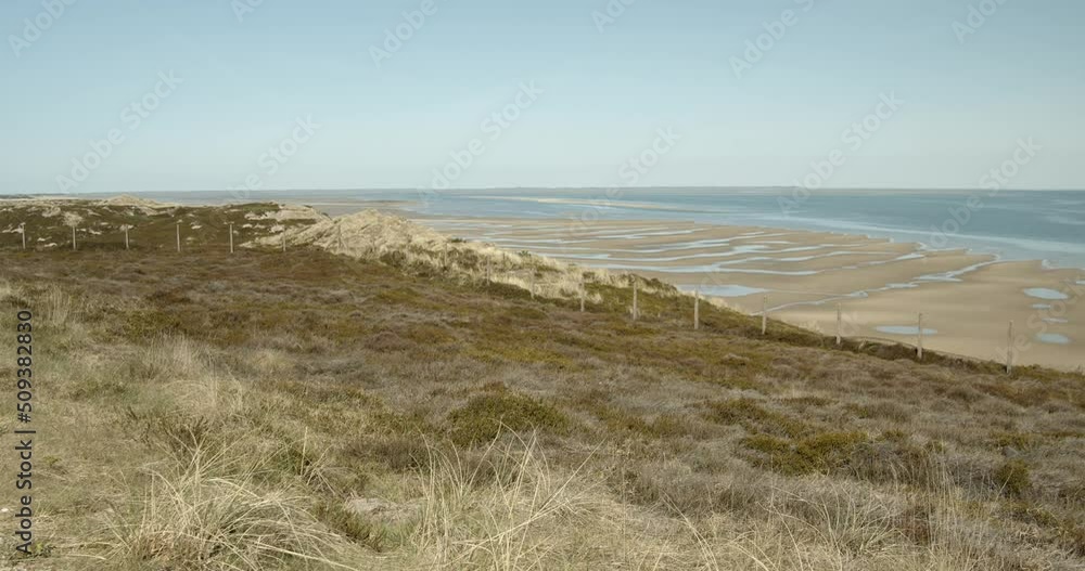 Wadden sea of Hönum of Sylt with a dune in the foreground 4k 60fps Wadden sea of Hönum of Sylt with a dune in the foreground 4k 60fps