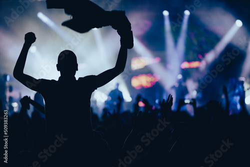 Man in a concert audience having fun on a music festival