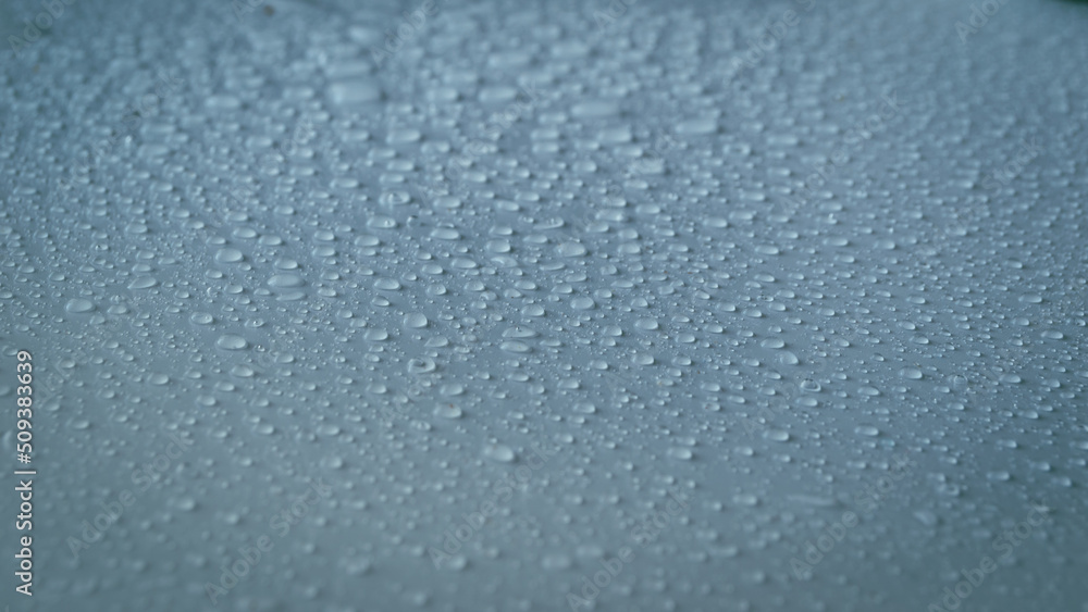 Abstract picture of rain drops. Water drops on gray-blue background.