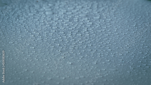 Abstract picture of rain drops. Water drops on gray-blue background.