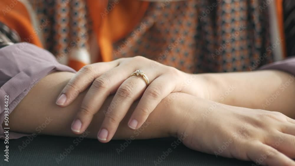 close up of women's hands with wedding ring close up of women's hands with wedding ring