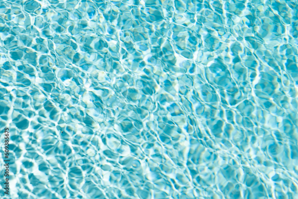 rippled water turquoise color in summertime swimming pool