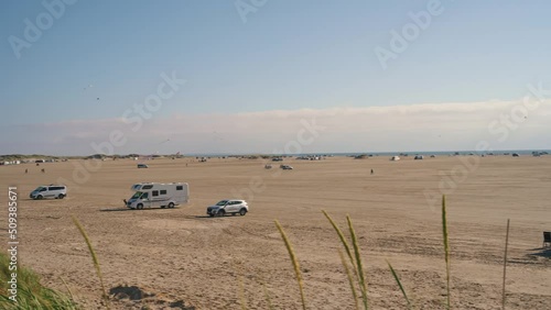 Panoramic view of the beach of  Rømø with parking caravans near the coast