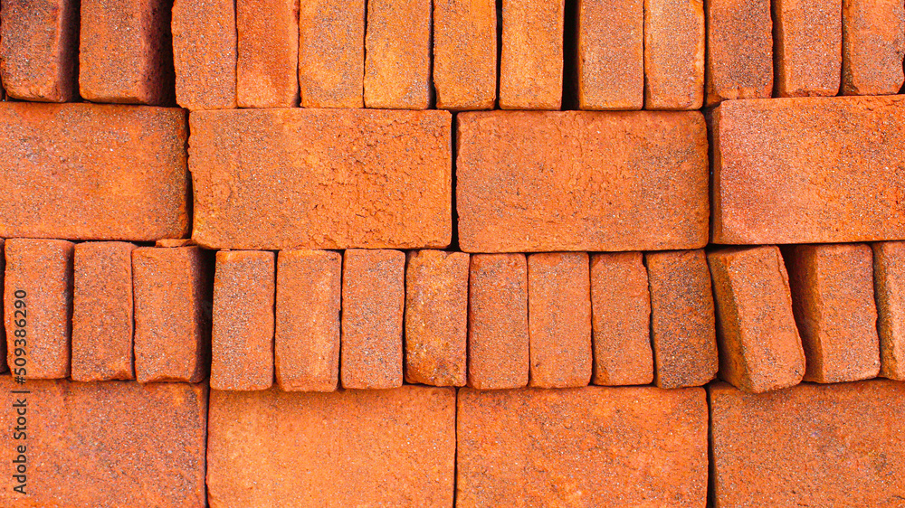 Fototapeta premium Red brick wall. Closeup view of red bricks as building materials