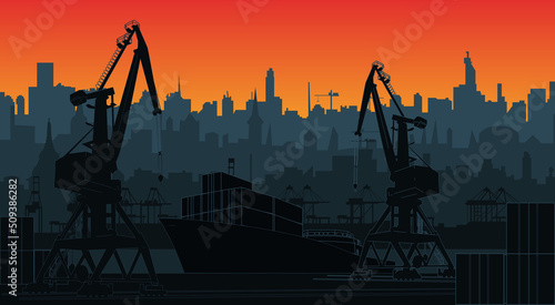 Silhouette commercial port with container ship at the pier and cargo cranes, city skyline on background with sunset sky. Cityscape and cargo port with cranes.