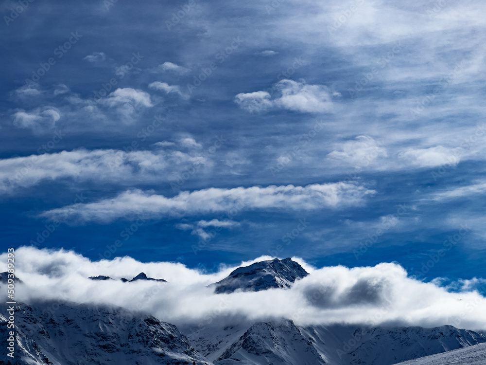 Panorama of Alps mountains and Mont Blanc peaks above clouds