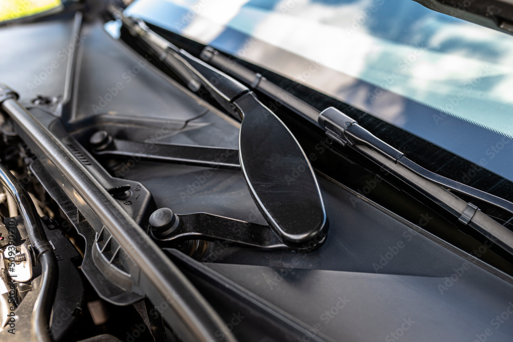 Front wiper mechanism on a modern premium car with a diesel engine.