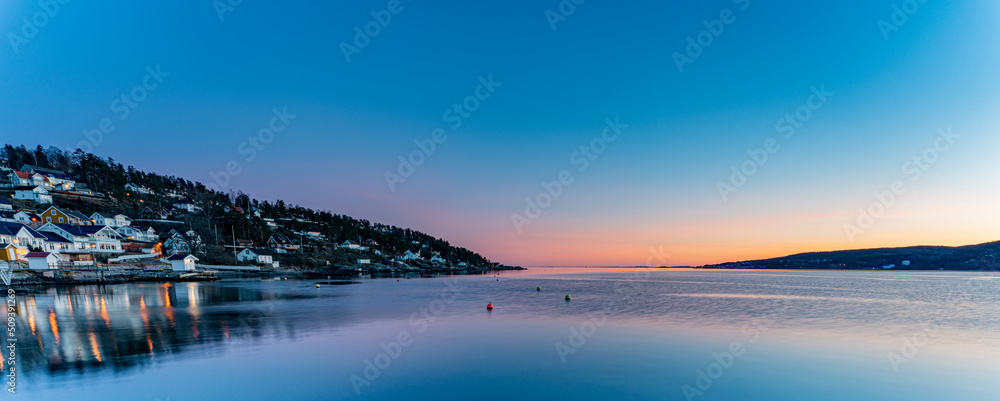 Sunset over the Oslofjord in the small town of Hvitsten, between Drobak and Son - obrazy, fototapety, plakaty 