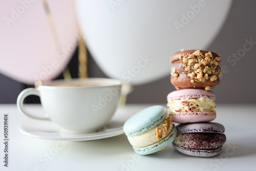 Quadro su tela Morning coffee with macaroons in a cafe, good morning birthday