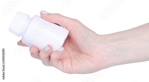 White medicine jar with pills capsules in hand on white background isolation