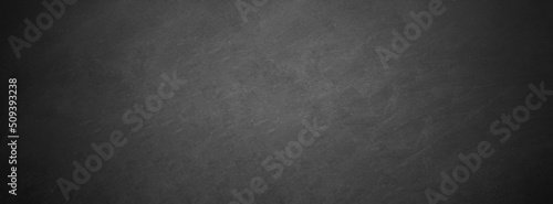 Foto dark texture chalk board and grunge black board banner background