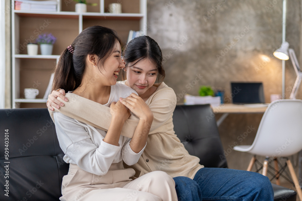LGBT Lesbian couple love moments happiness , lovely lesbian couple spending time together and having fun at living room, LGBT concept. LGBT Lesbian couple love moments happiness , lovely lesbian couple spending time together and having fun at living room, LGBT concept.