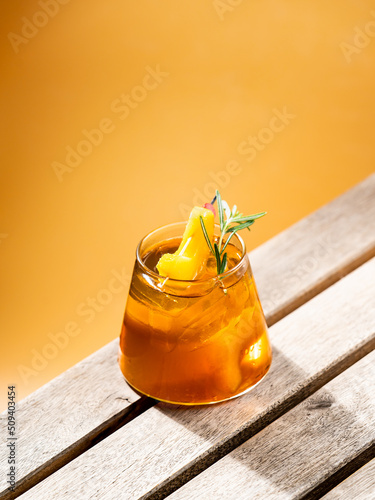 Homemade peach ice tea on the wooden table