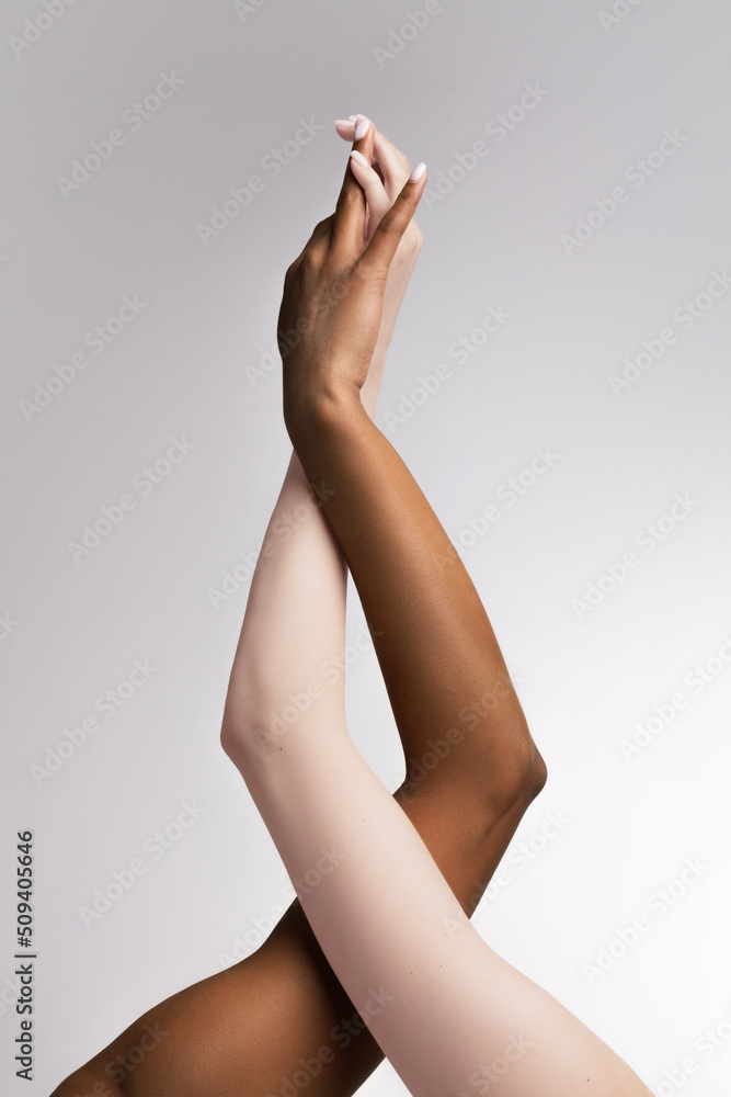 Plexus of female hands. Graceful female hands touch each other isolated on grey studio background. Concept of diversity, unity, love, support - obrazy, fototapety, plakaty 