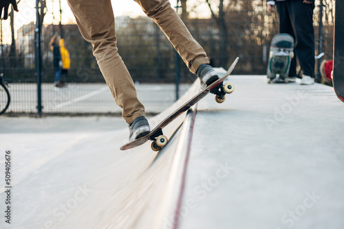 Young skateboarder skateboarding at city