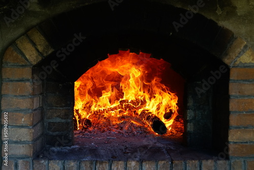 Fotografiet Fire burning in the wood oven