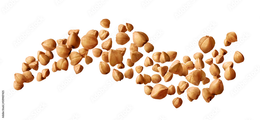 Buckwheat groats flying isolated on white background Buckwheat groats flying isolated on white background