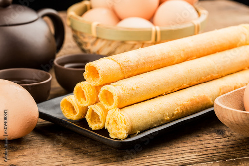 Egg roll biscuit on plate photo