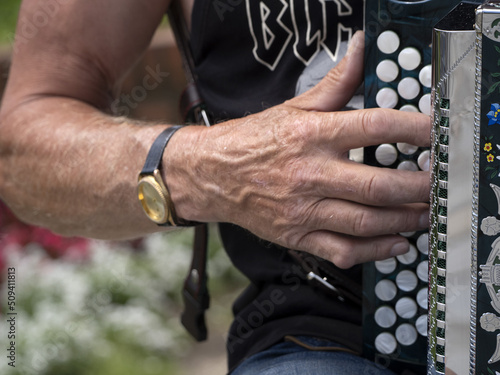 Hands playing accordion detail photo