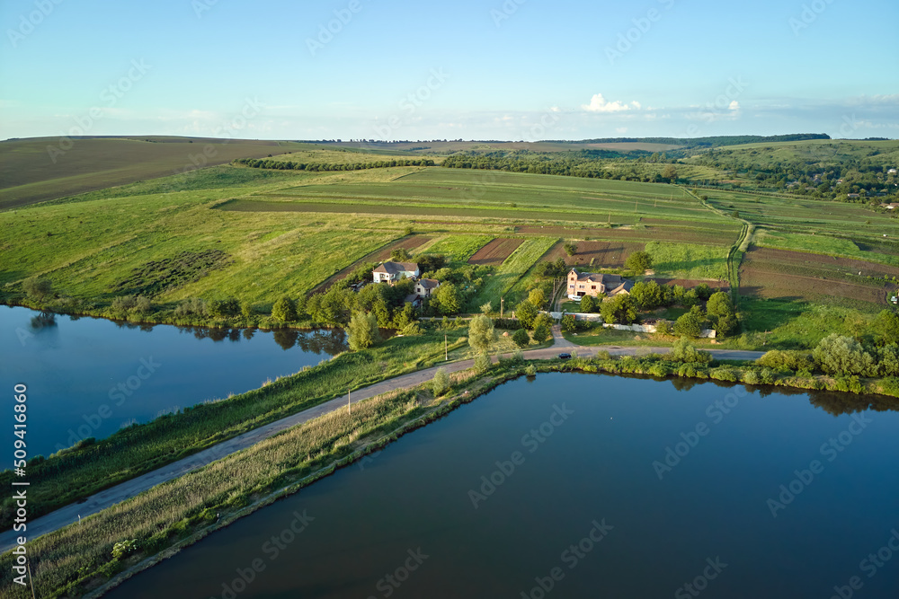 Aerial view of fish hetching pond with blue water in aquacultural area