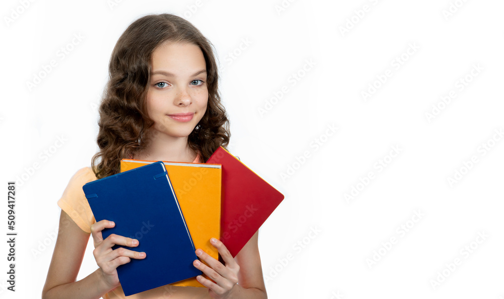 Happy teenager student holds books. Happy teenager student holds books.