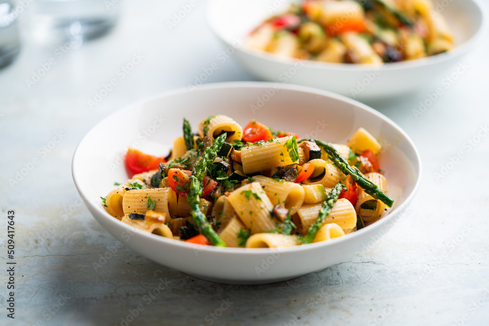 Pasta salad with grilled vegetables, zucchini, eggplant, asparagus and tomatoes. Pasta salad with grilled vegetables, zucchini, eggplant, asparagus and tomatoes.