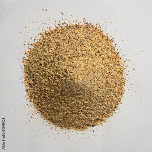 pile of ground horse gram, macrotyloma uniflorum, tropical south asian legume most protein rich lentil, isolated neutral gray background, taken from above photo