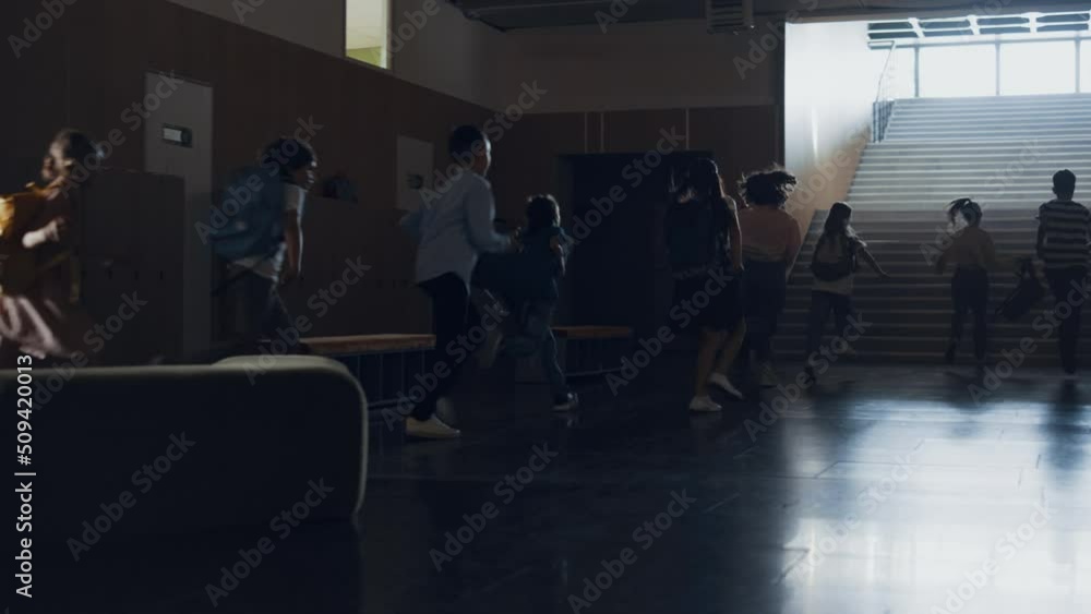 Group pupils running out classroom heading staircase. Teenagers leaving classes. Group pupils running out classroom heading staircase. Teenagers leaving classes.