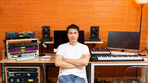 Billede på lærred portrait of young asian professional music producer smiling with friendly eyes i